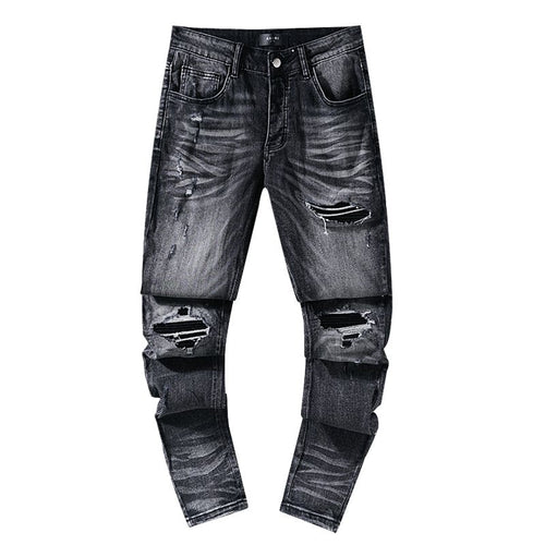 AMIRI Washed Black Distressed Jeans — hero